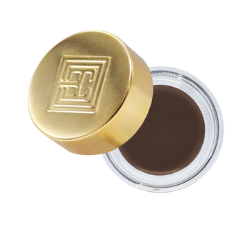 Ein kleines Glasgefäß mit goldenem Deckel enthält Brow Code Creamade Augenbrauen-Pomade in 6 Farben für langanhaltende Brauen. Blashy Shop